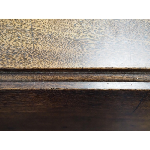 84 - Mahogany drop leaf dining table with a knuckle hinge and on brass casters 40