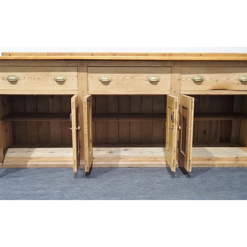 12 - Pine dresser base with cupboards, shelves and 3 drawers 36