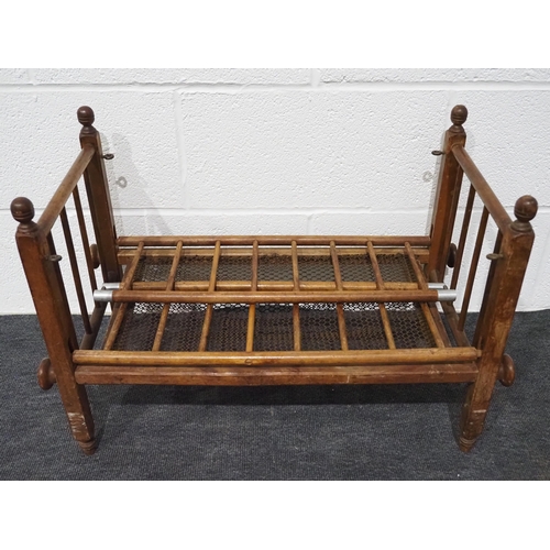 136 - Small wooden folding travel cot with metal mesh