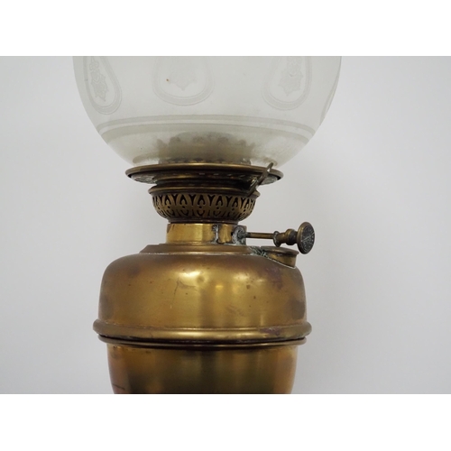 125 - Original Victorian brass oil lamp complete with globe and chimney