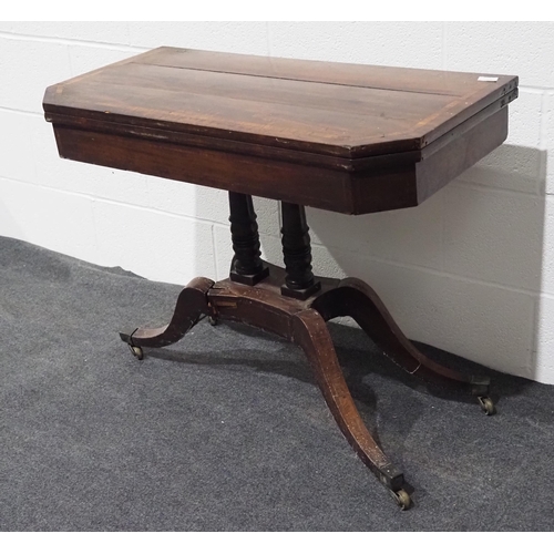 154 - Victorian mahogany swivel top folding games table with inlay, pedestal base and on brass casters 36