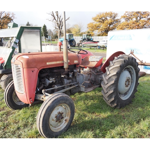1010 - Massey Ferguson 35, 3-cylinder diesel tractor. Runs and drives. C/w Ferguson 2 furrow plough and pot... 