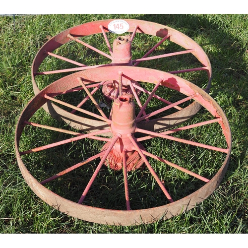 145 - Pair of cast iron wheels