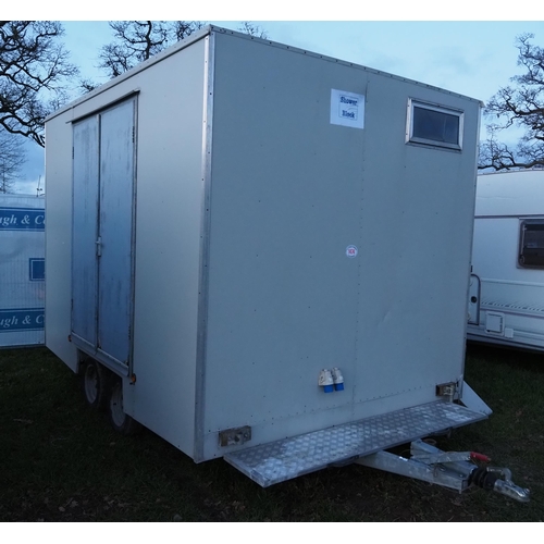 1474 - Twin axle towable double shower unit with on board water tank.