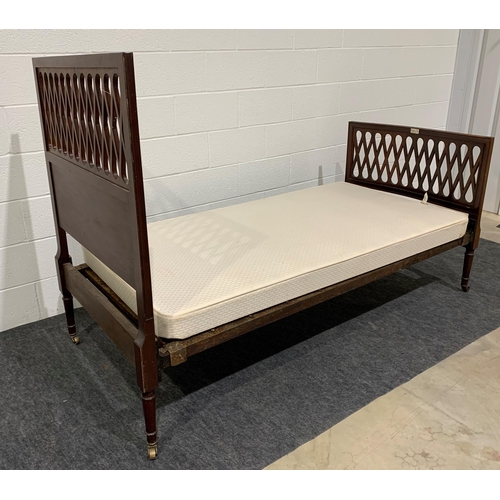 245 - Small Edwardian mahogany single bed on brass casters with mattress and makers stamp 