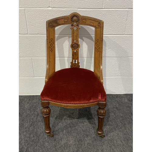 253 - Set of 4 carved oak chairs with red velvet seats on brass casters