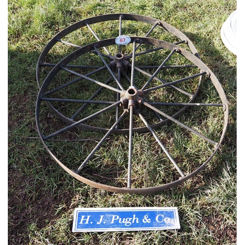 67 - Pair of cast iron wheels