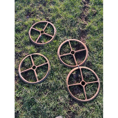 671 - Metal barrow and 4 cast iron wheels