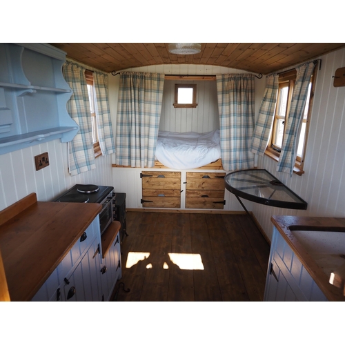 1472 - Shepherds hut, 19 x 8ft. Fully insulated, c/w cooker, Belfast sink, table and chairs. Bed is fully m... 