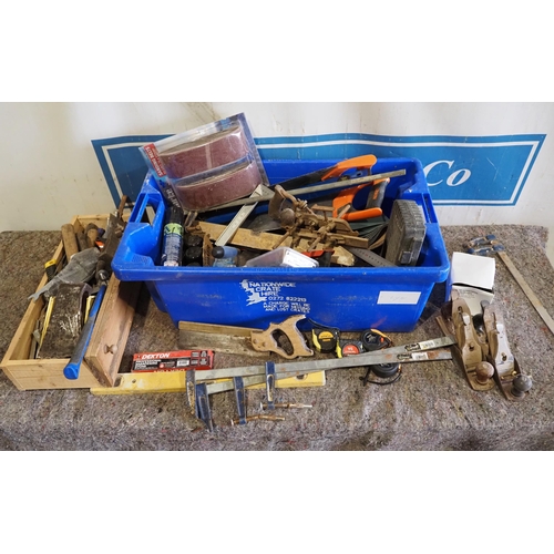 584 - Large quantity of assorted tools to include sash clamps, hammers, axe heads, planes, spray paints et... 