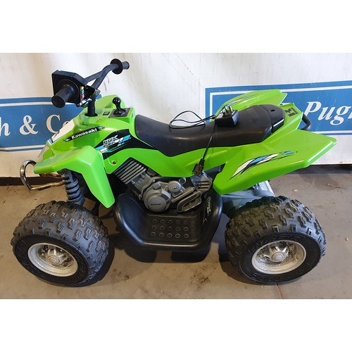 571 - Childs electric quad bike with Kawasaki logo, charger in office.