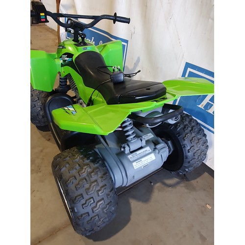 571 - Childs electric quad bike with Kawasaki logo, charger in office.