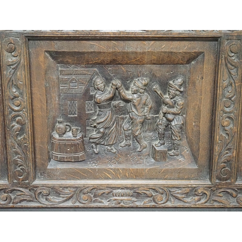 13 - Victorian oak heavily carved hall bench with storage compartment and depicting tavern scenes 51