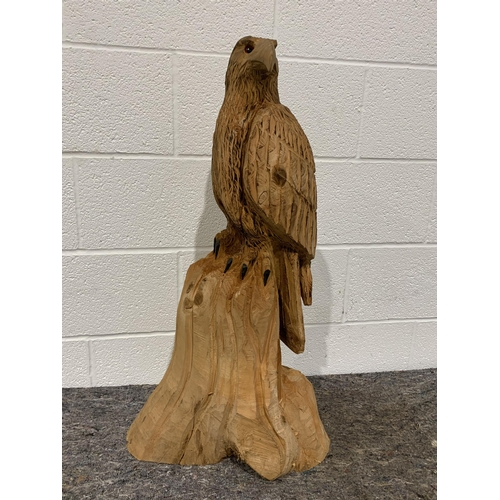 68 - Carved wooden bird on prey on 34