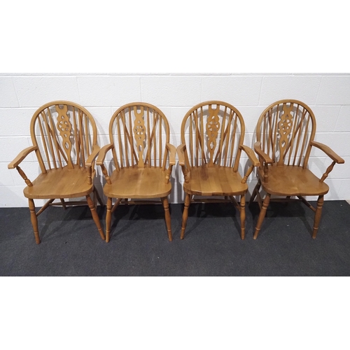 73 - Set of 4 beech wheel back arm chairs