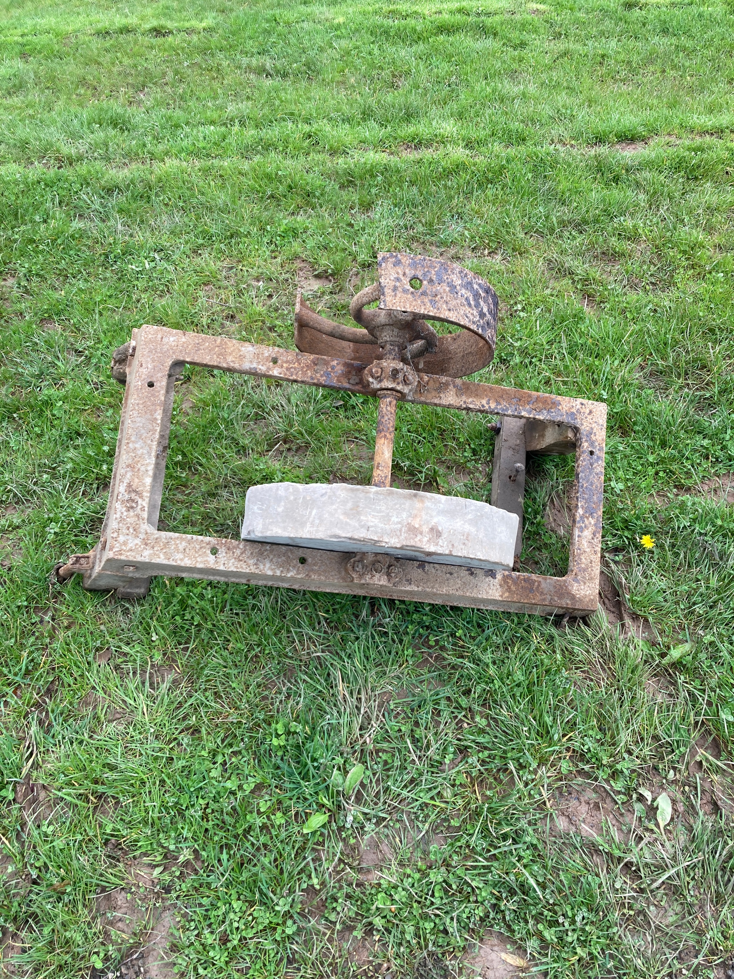 Grindstone on pulley wheel and frame