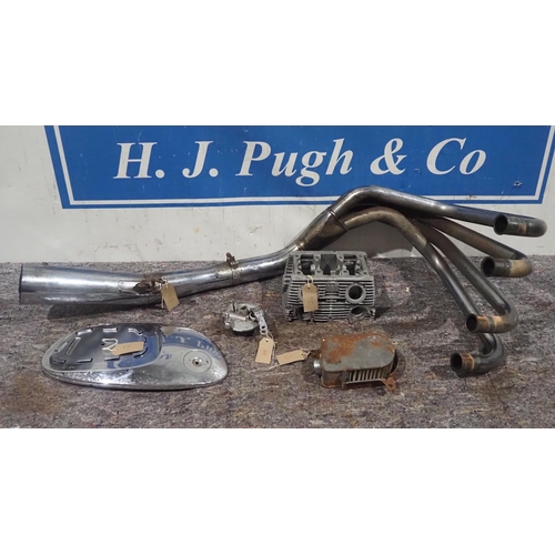 668 - Assorted Honda motorcycle spares to include CB750 exhaust, CB160 cylinder head