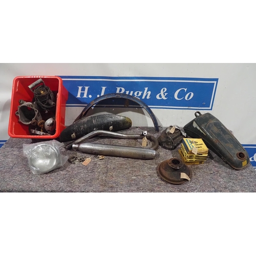 670 - Assorted British motorcycle spares to include Royal Enfield and Raleigh and Lucas headlamp