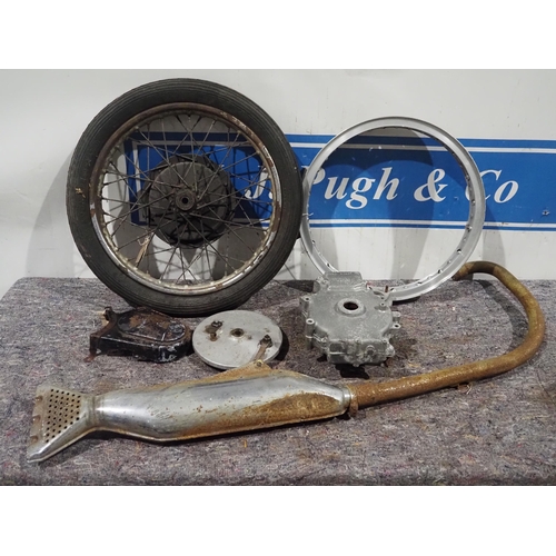 673 - Norton International front wheel, brake plate, Velocette exhaust, crank cases and Borrani wheel rims