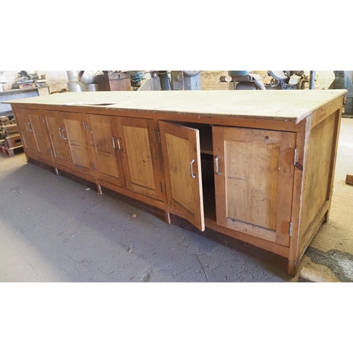 169 - Wooden workbench with 8 doors below, 144 x 36