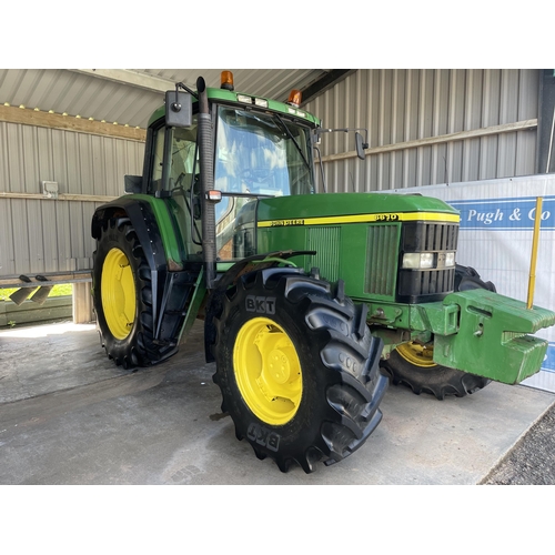 113 - John Deere 6610 4wd tractor. 1998. Runs and drives. 12,500 hours showing. Fitted with front weights.... 