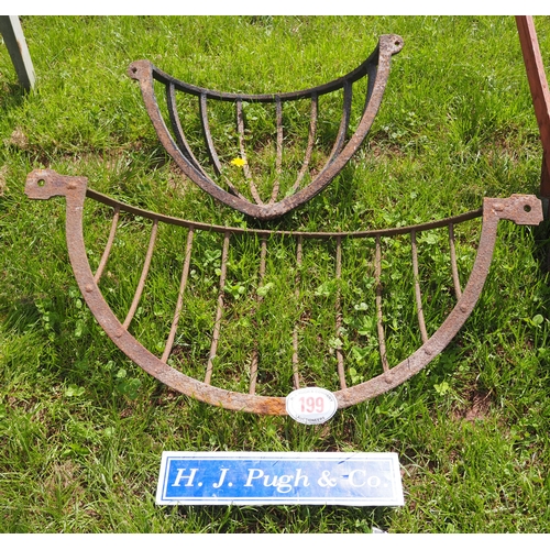 199 - 2 Cast iron wall hay racks