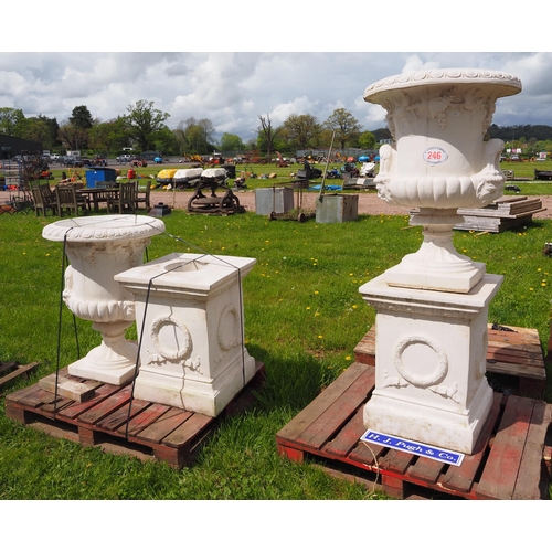 246 - Pair of 6ft urns on plinths