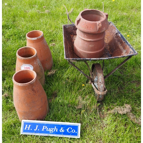 395 - Wheelbarrow, chimney pot and rhubarb forcers