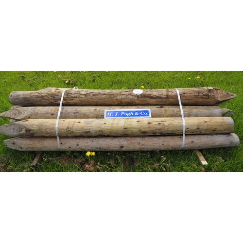 1064 - Peeled round stakes 8' x 6-7