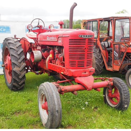 1421 - Farmall model BM tractor with wheel weights. Starts and drives. Serial Number B5740. Reg. RPW 831