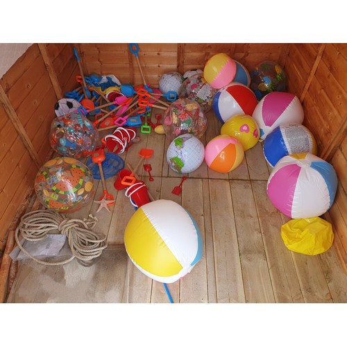 217A - Children's beach balls, spades and buckets