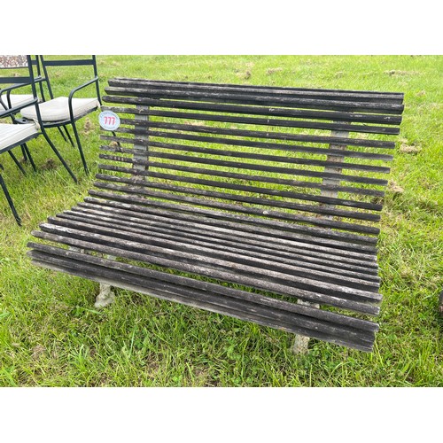 777 - Garden bench with ornate cast iron bench