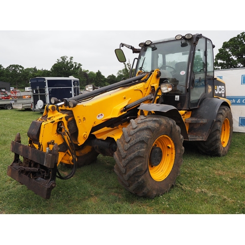 1934 - JCB TM310S with loading shovel fitted pick up hitch. Showing 7060 hours. Runs and drives. Reg. CU60 ... 