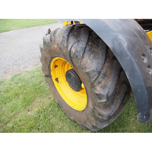 1934 - JCB TM310S with loading shovel fitted pick up hitch. Showing 7060 hours. Runs and drives. Reg. CU60 ... 