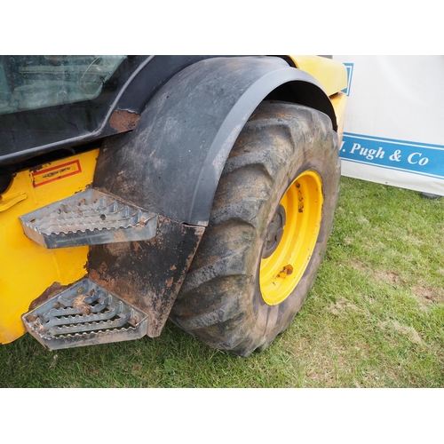 1934 - JCB TM310S with loading shovel fitted pick up hitch. Showing 7060 hours. Runs and drives. Reg. CU60 ... 