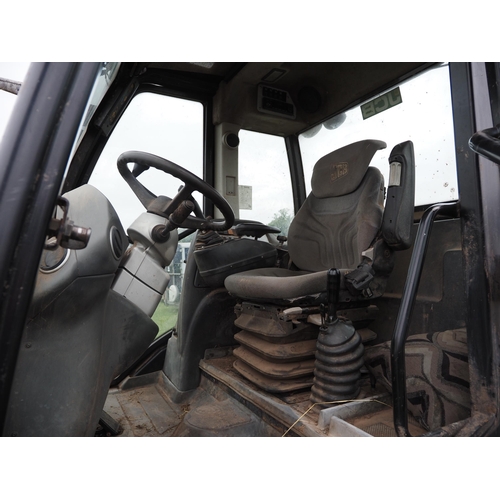 1934 - JCB TM310S with loading shovel fitted pick up hitch. Showing 7060 hours. Runs and drives. Reg. CU60 ... 