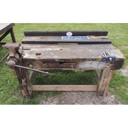 98 - Wooden workbench with 2 vices