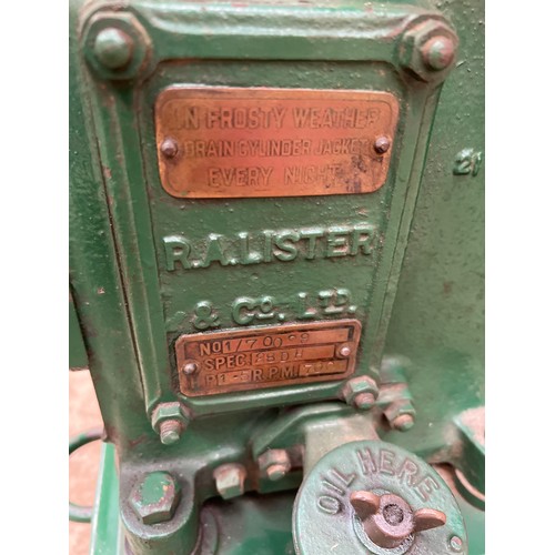 185 - Lister D stationary engine on original trolley. 1.5HP. S/No. 1/70099. C/w Lister water pump. No. H10... 