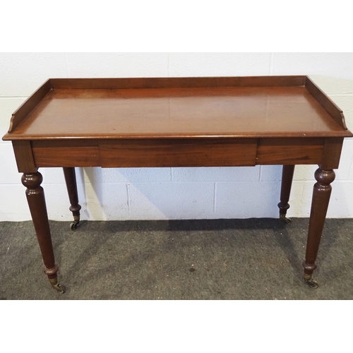 430 - Mahogany desk with drawer on brass casters 46