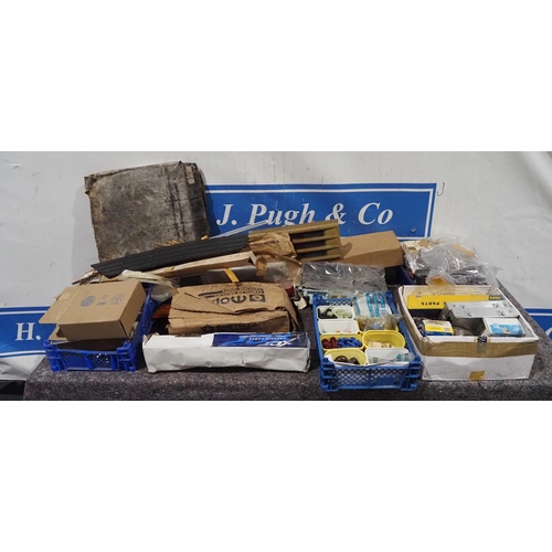 64 - Assorted NOS American car parts to include headlights, steering suspension parts etc.