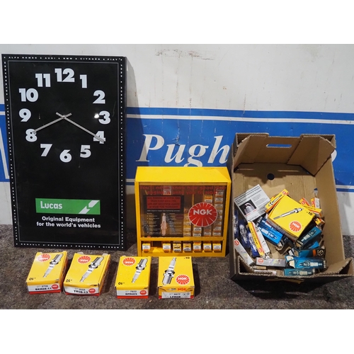 110 - Lucas plastic clock and NGK spark plug display stand and plugs