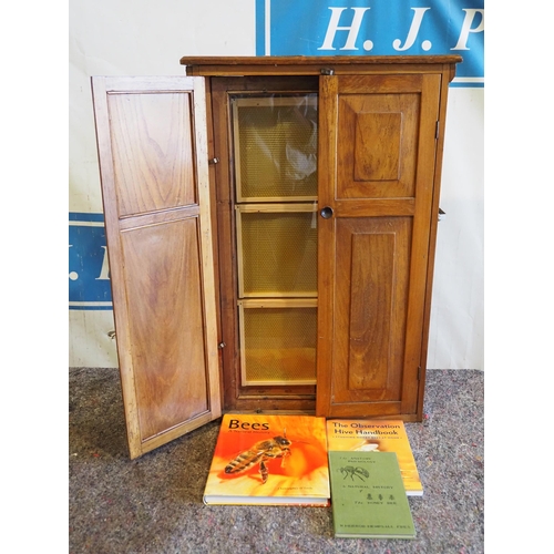 1048 - Wooden display cabinet with bee hive display and bee keeping books