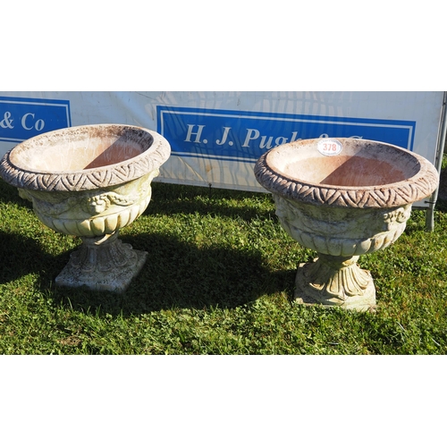 378 - Pair of planters on plinths 24