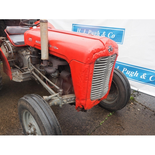 100 - Massey Ferguson 35 tractor. Runs and drives, 4-cylinder. S/N SDM141026