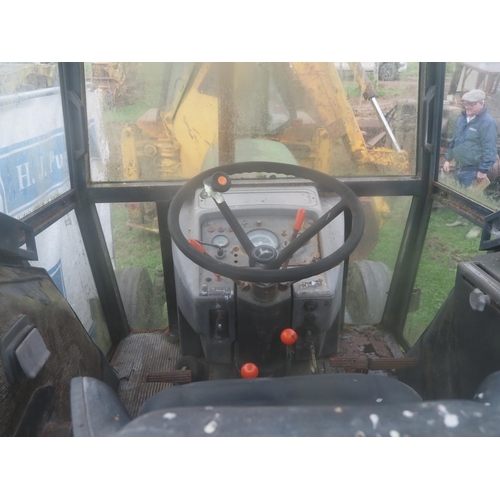 60 - John Deere 3130 tractor, front weights, showing 7036 hours Reg. XAM 410T. Runs, one rear wheel stuck... 