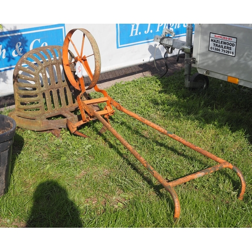 54 - Push hoe and cast iron saddle holder