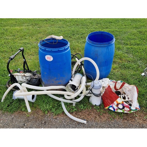 492 - Paddling pool pumps, filters, bike rack, water butts, spanners, etc.