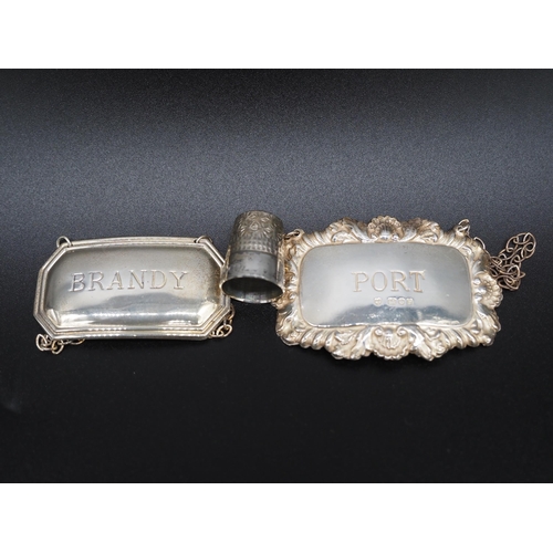 203 - Silver decanter labels and silver thimble. Approx. 13g