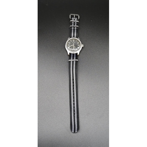 216 - Cyma WWII military wrist watch. This watch has been recently serviced and comes with service documen... 