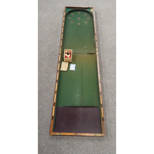 238 - Antique Bagatelle flip top games table with stand complete with balls. 84